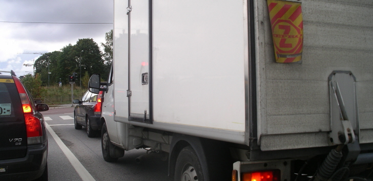a truck driving in traffic