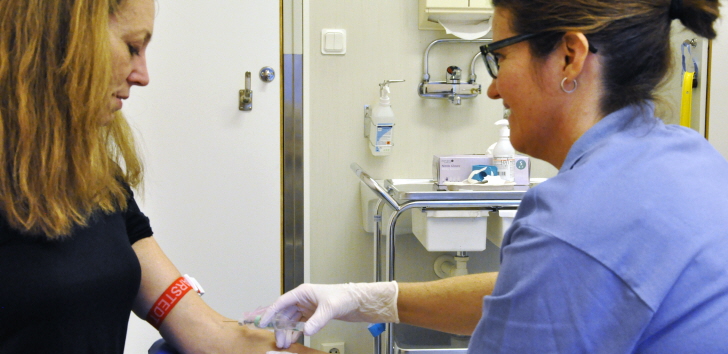 nurse taking blood samples from patients